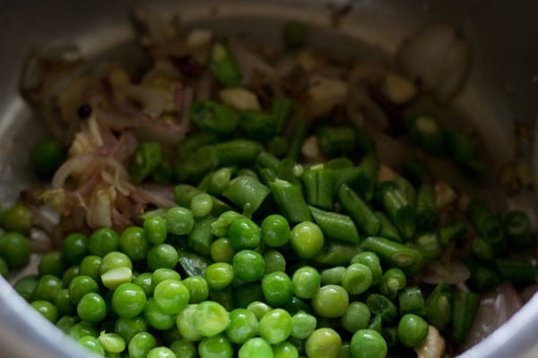 adding vegetables - green peas, chopped french beans 