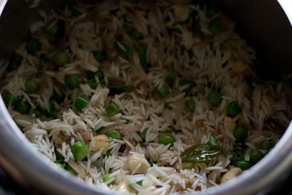 mixing basmati rice with other ingredients.