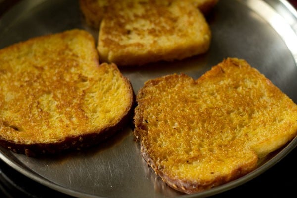 toasted eggless french toasts on a plate. 