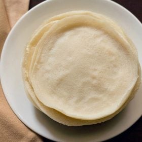 spring roll wrappers placed on a white plate.