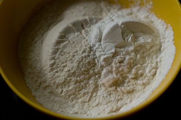 all purpose flour, cornstarch and salt added in a bowl for spring roll sheets. 