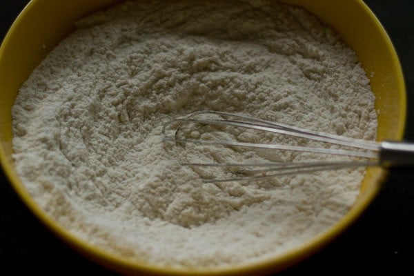 mixing the dry ingredients in the bowl.