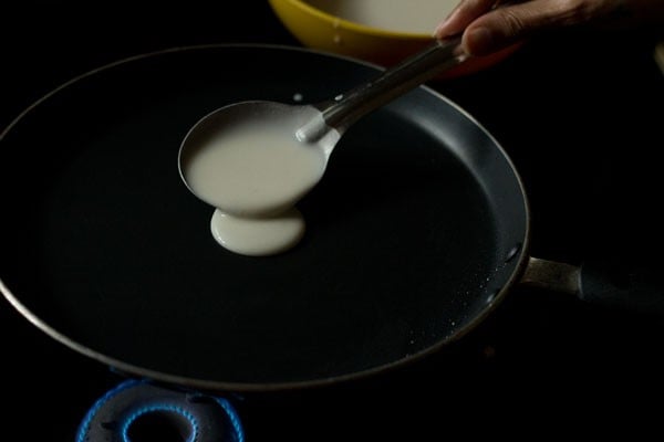 preparing spring roll sheets on the seasoned pan. 