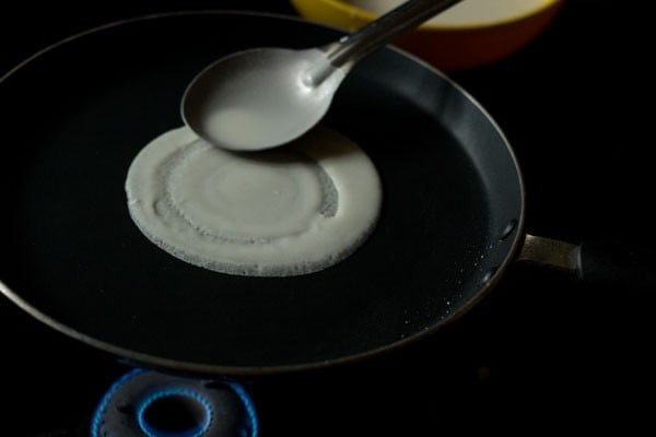 spreading prepared batter to make spring rolls sheets. 