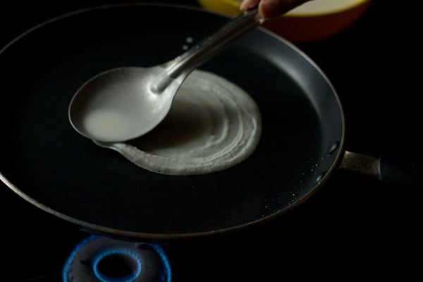 spreading prepared batter to make spring rolls sheets. 