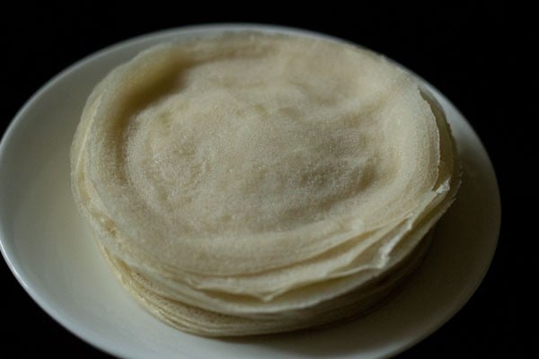 cooked spring roll sheets stacked on top of one another. 