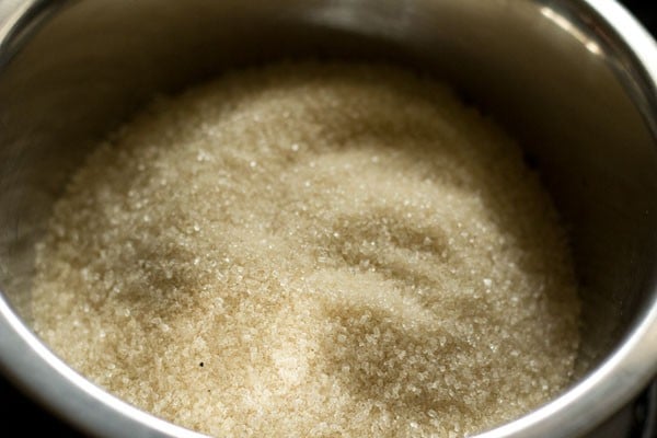 sugar added in a pan. 