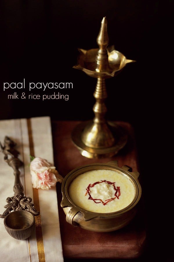 paal payasam garnished with dried rose petal chiffonade in a brass bowl with text layovers.