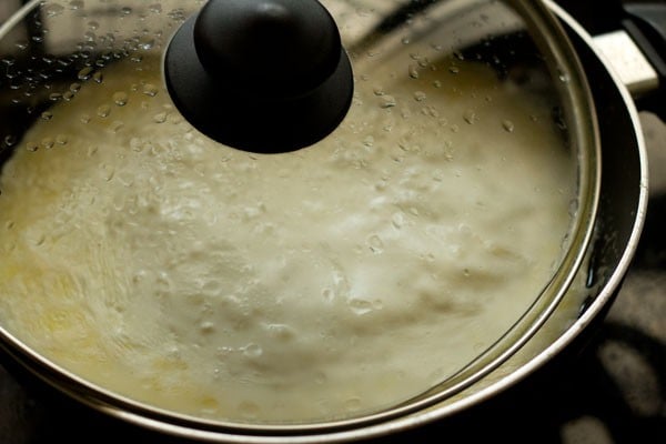 pan covered with lid with some space at the side for steam to pass through.