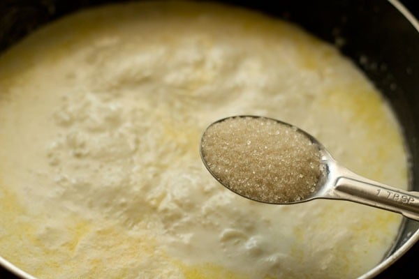 adding sugar in the payasam. 