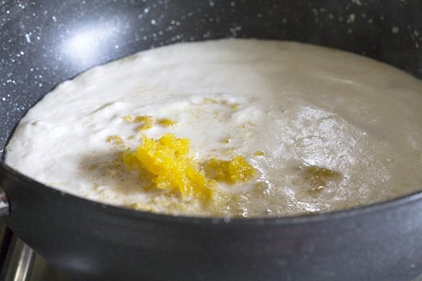 pumpkin puree added to the pot for making pumpkin payasam recipe.