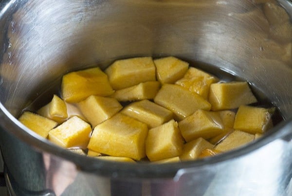 cooking pumpkin in water for making pumpkin kheer.