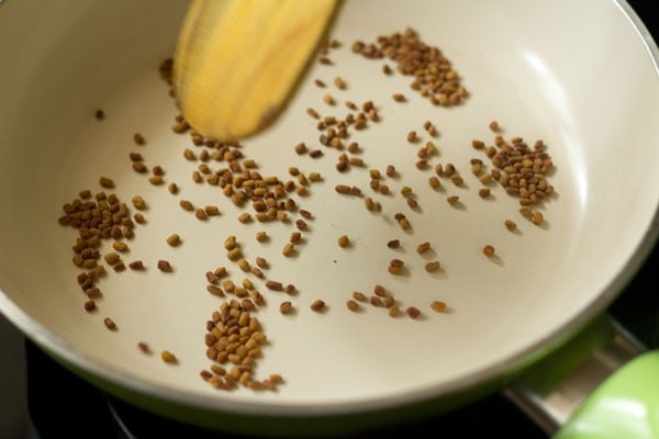 methi (fenugreek) seeds have become several shades darker from toasting