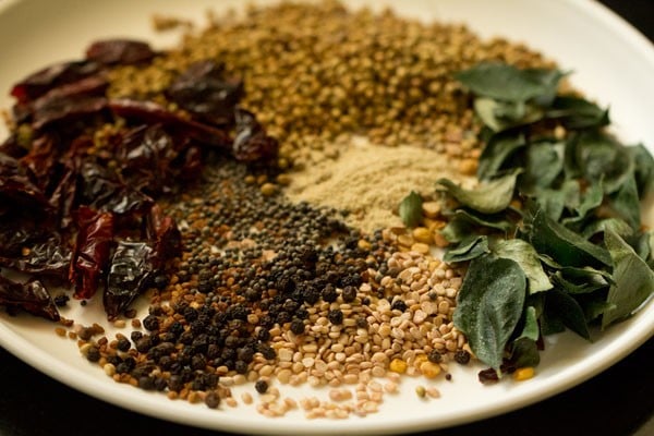 roasted spices for sambar masala in whole form on a plate