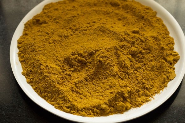 sambar powder on a plate for cooling and mixing after grinding