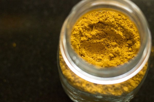 homemade sambar podi masala powder recipe in a clear glass jar