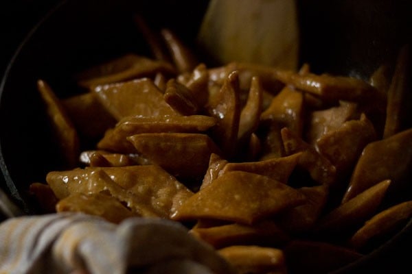 shakkarpara coated with sugar syrup. 