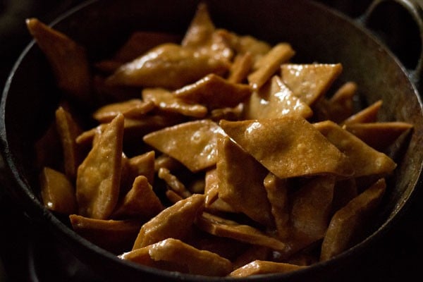 shakkarpara coated with sugar syrup. 