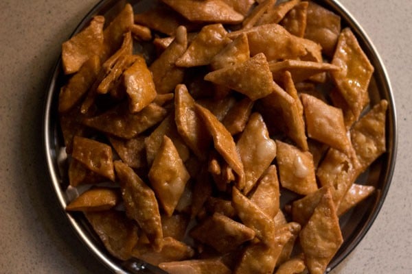 sugar syrup crystalizing on shakkarpara. 