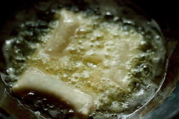 frying three vegetable spring rolls