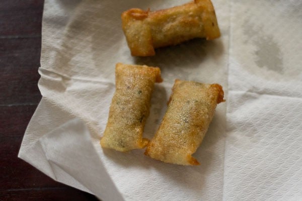 vegetable spring rolls draining on paper towels