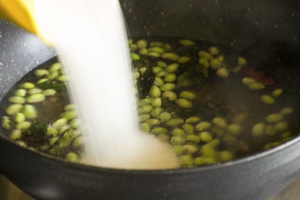 adding prepared ground rice-pepper mixture for uppittu recipe. 