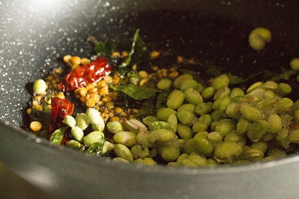 lilva beans added and mixed with the tempering for the uppittu recipe.