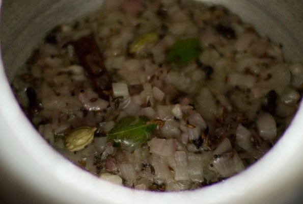 chopped onions and curry leaves added to the spices. 