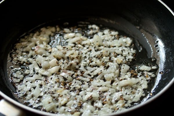 sauteing onions in the pan