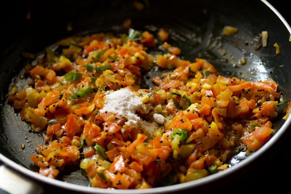 salt added to masala mixture in the pan