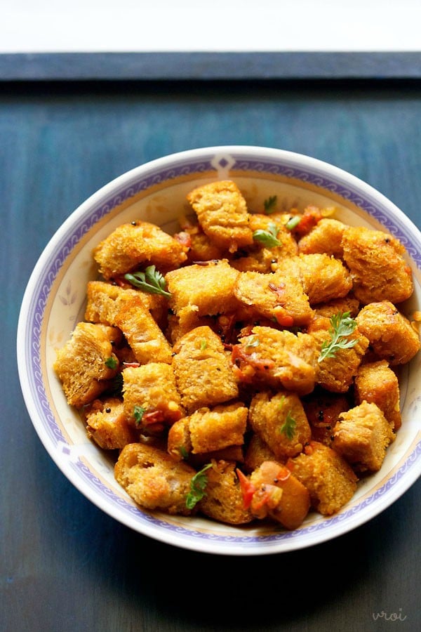 bread upma served in a white bowl