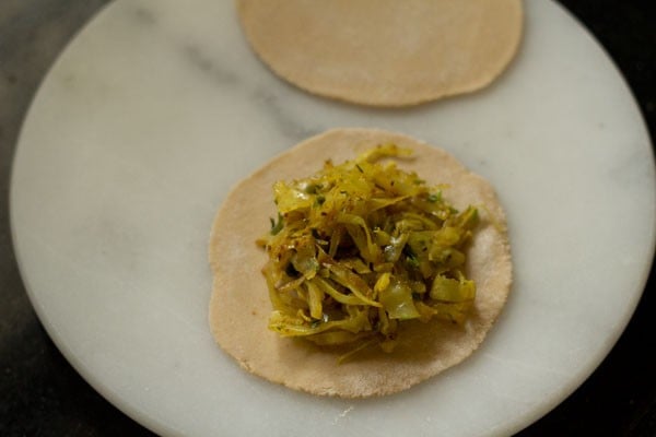 cabbage stuffing added on rolled paratha 