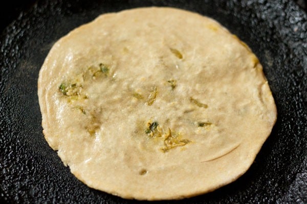 frying flipped cabbage paratha side