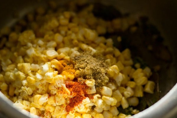 adding spices for corn rice