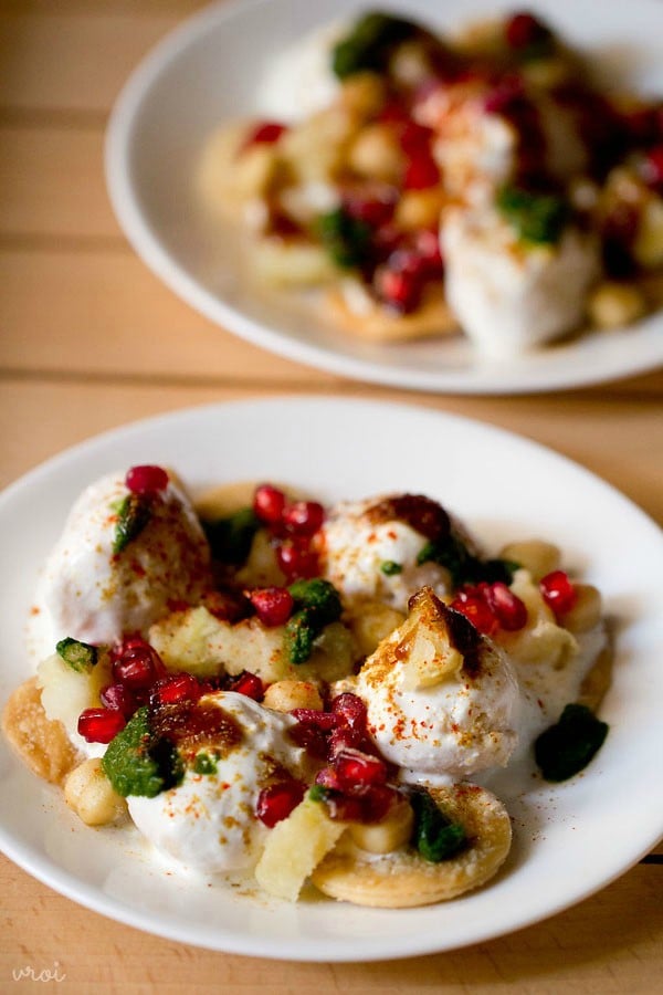 dahi bhalla served on a white plate. 