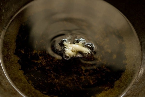 testing temperature of hot oil for frying bhallas. 