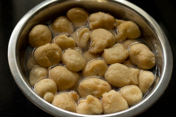 soaking fried bhallas in water. 