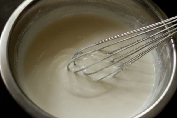 beating curd till smooth. 