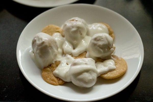 dahi bhalla placed on the plate. 