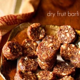 dry fruit barfi on a plate with text layovers.