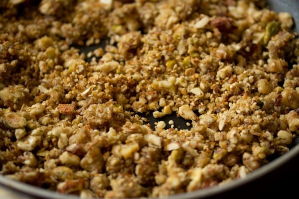 nuts are getting toasted in the pan.