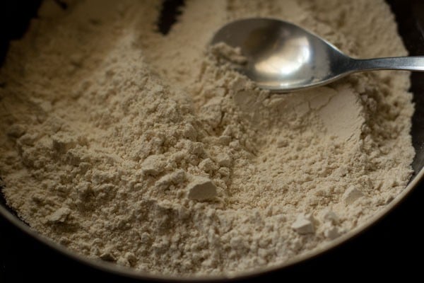 mixing the ingredients in the bowl. 