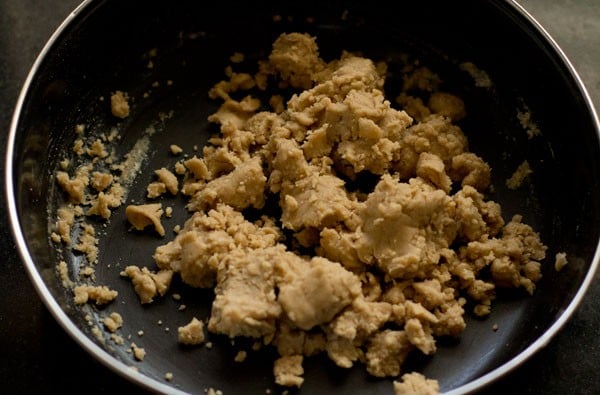 mixing the oil with the flour in the bowl. 