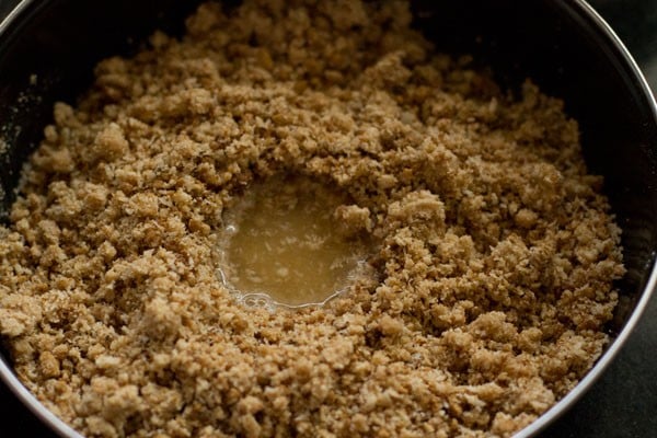 adding water to the flour mixture and mixing well. 