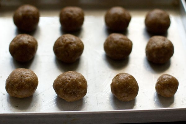 small size dough balls on the greased tray. 