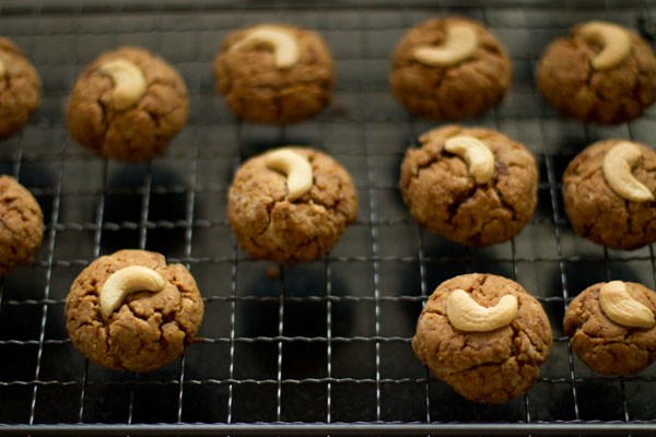 baked coconut cookies kept on a wire rack for cooling. 