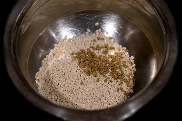 black gram and fenugreek seeds for making millet idli. 