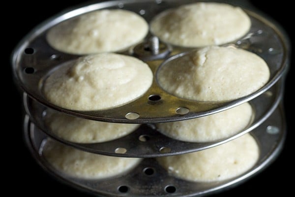 stand with steamed idlis. 