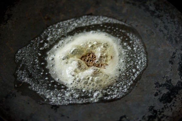 spluttering cumin seeds in butter. 