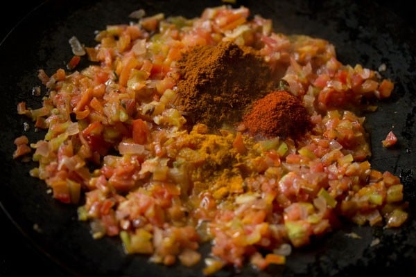 turmeric powder, red chili powder and pav bhaji masala added to the onion-tomato mixture. 